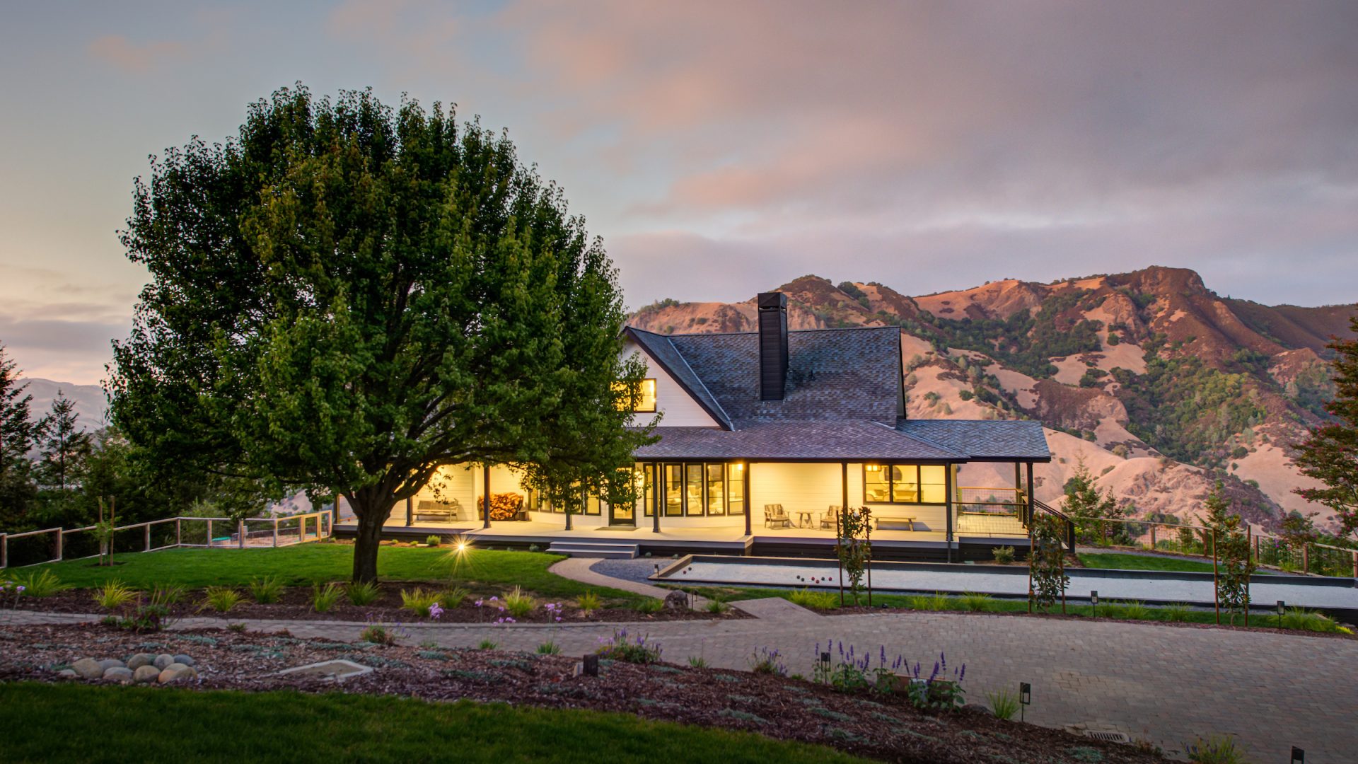 Custom home exterior dusk by Sonoma County home builders LEFF Design Build.