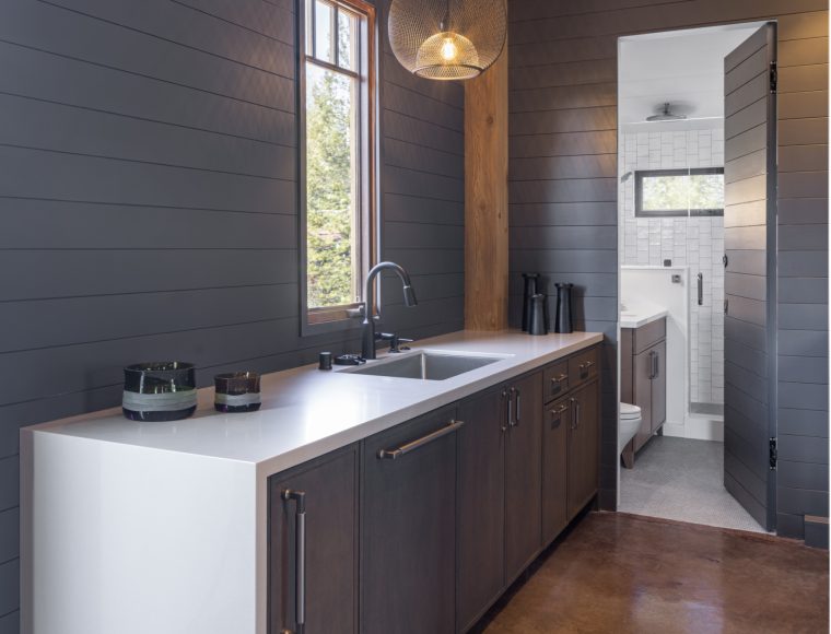 Custom home bathroom remodel countertop with view to bathtub.